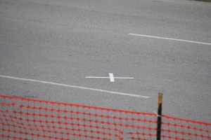 The location in the street at Dealey Plaza where Kennedy received the dealy head shot.